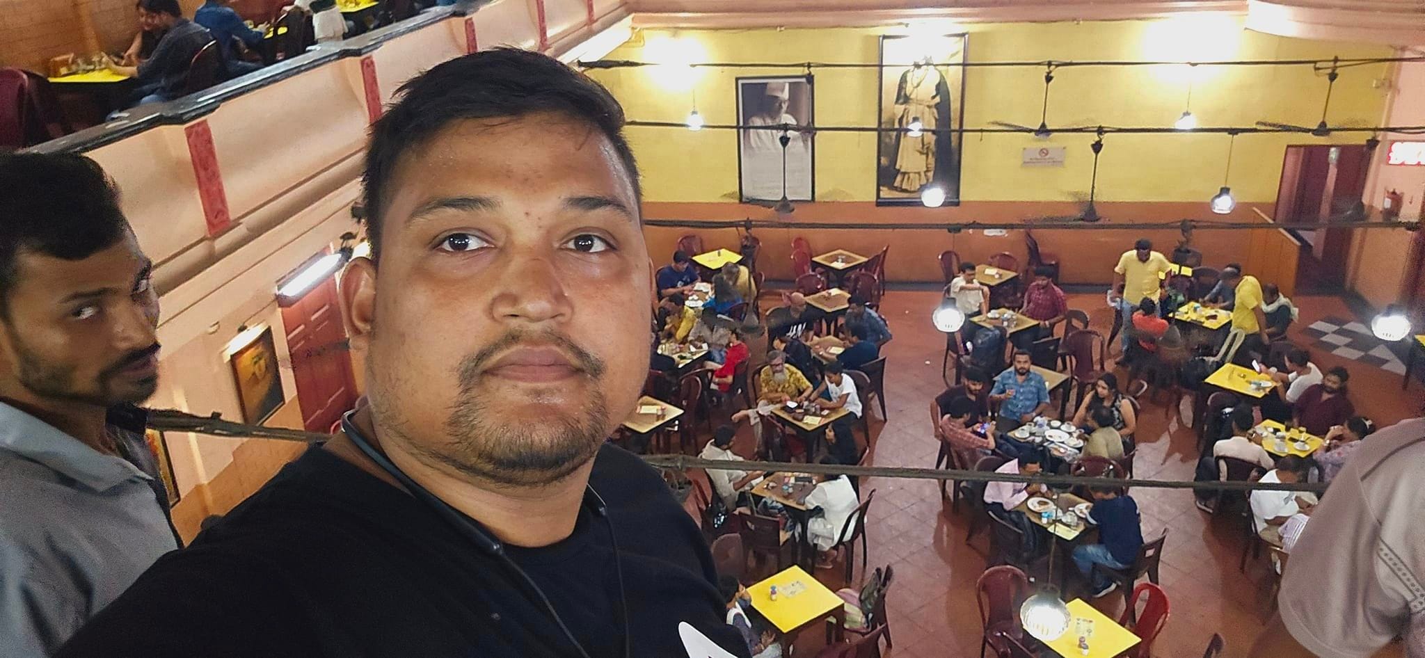 Patrons sitting inside the historic and iconic College Street Coffee House